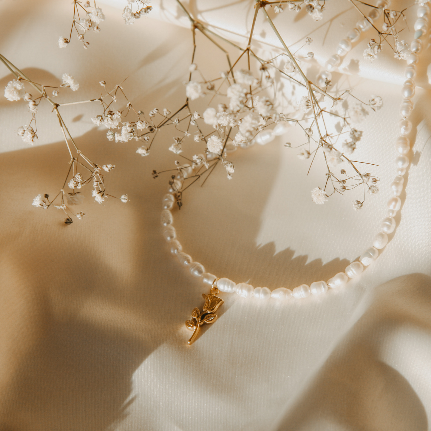 pearl necklace with golden rose charm inspired by beauty and the beast